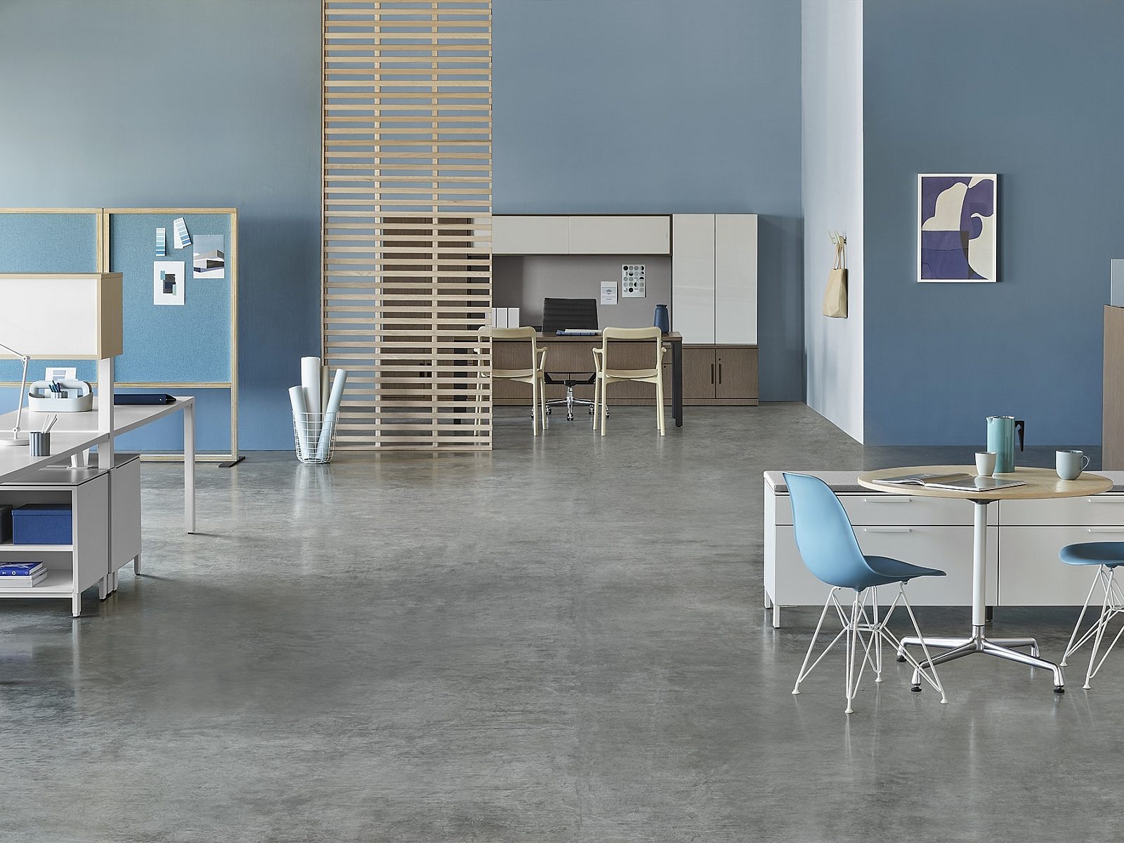 blue walls with white and ash workstations