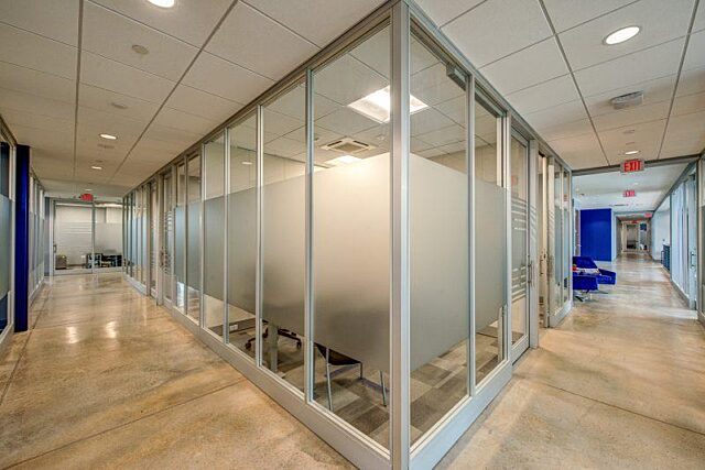 corner of glass walls with opaque strip in center
